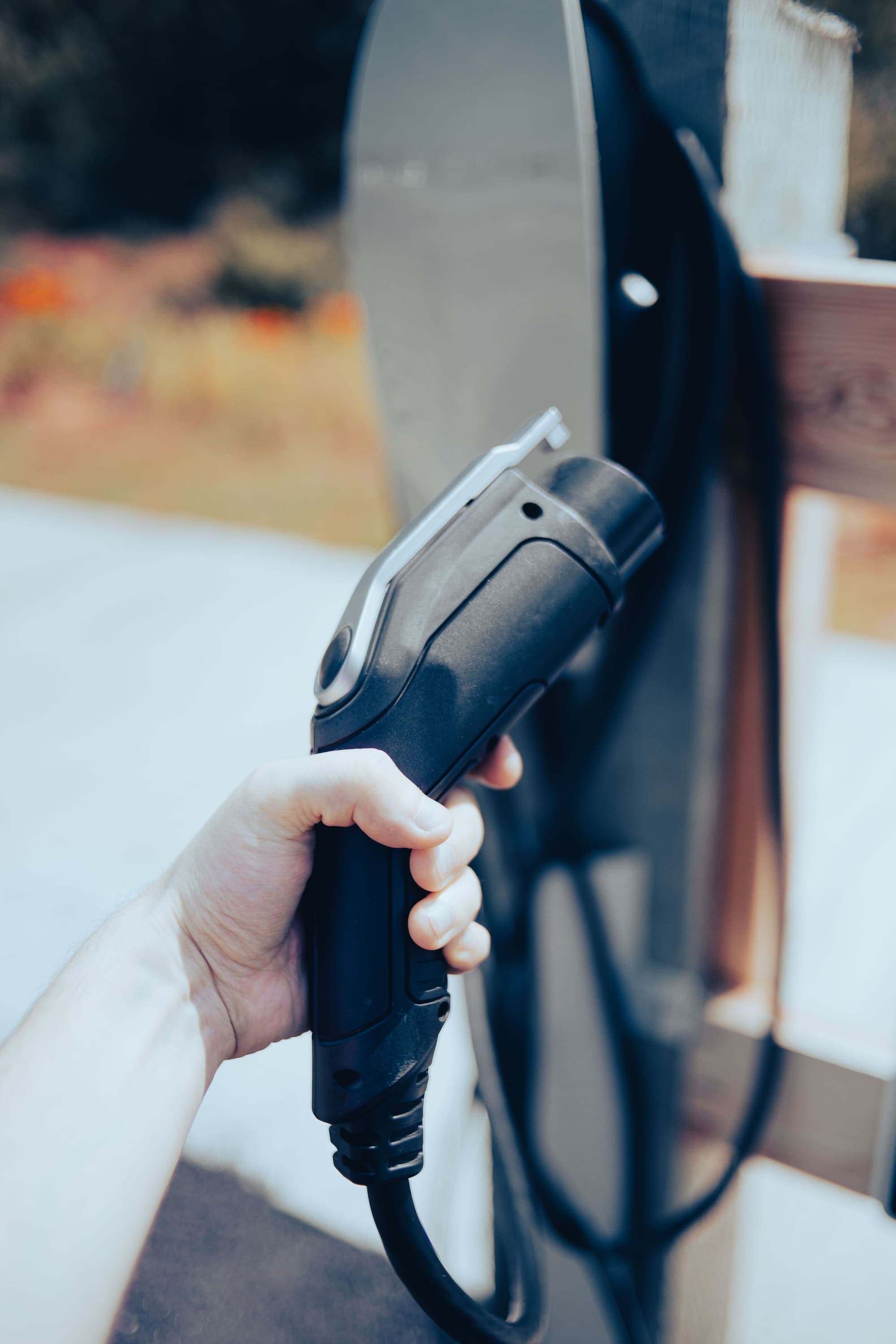 Electric vehicle connected to a charging station.